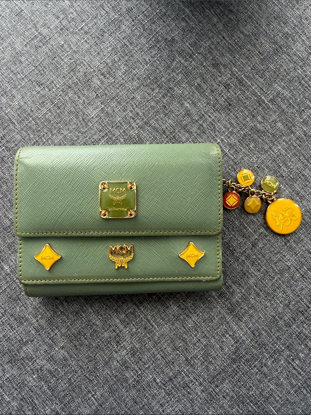 MCM Princess Lion Green Leather Compact Wallet with Gold Charm Accents
